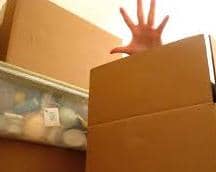 hand behind box